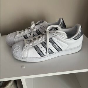 Adidas Superstar size 9. White with metallic silver stripes.